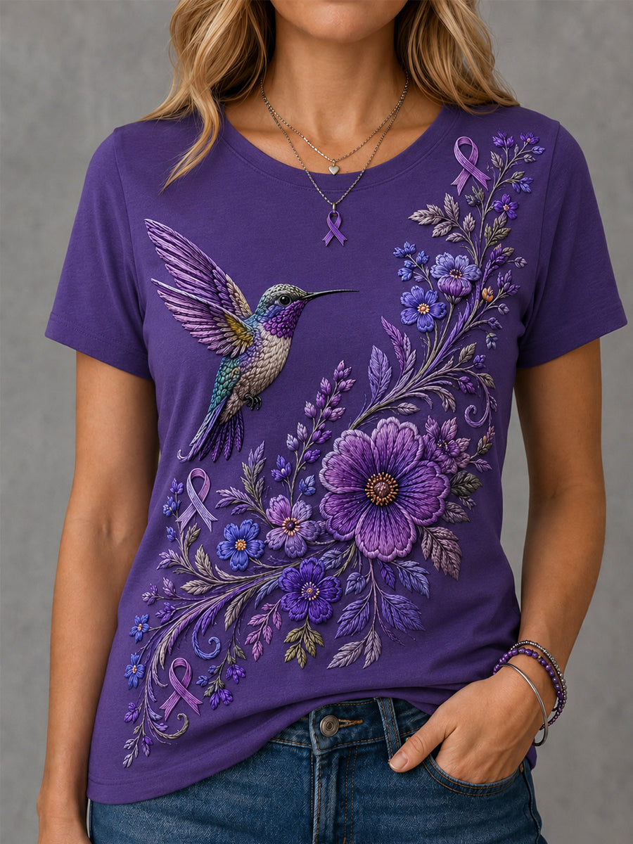 Damen-T-Shirt in Lila mit Blumen- und Kolibri-Print zur Sensibilisierung für die Alzheimer-Krankheit