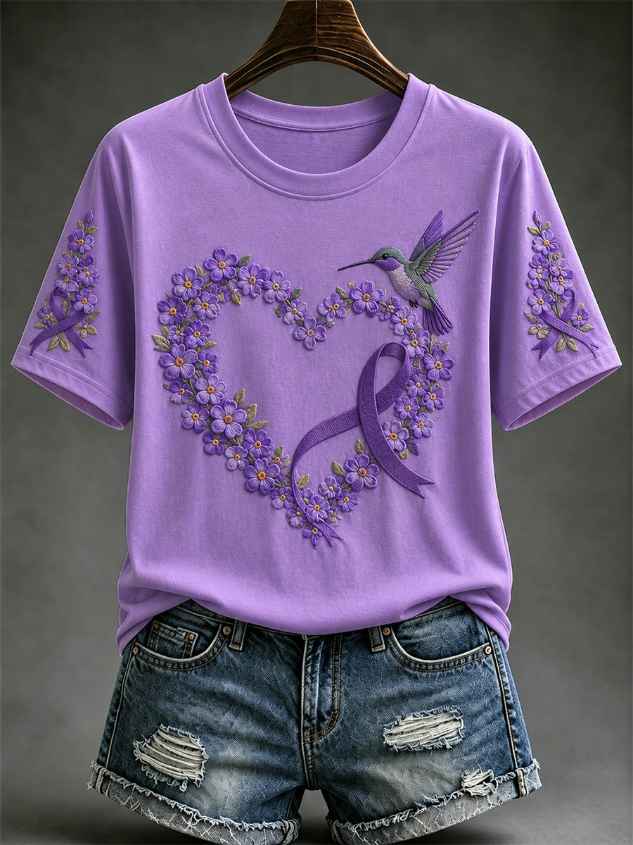 Damen-T-Shirt in Lila mit Blumen- und Kolibri-Print zur Sensibilisierung für die Alzheimer-Krankheit