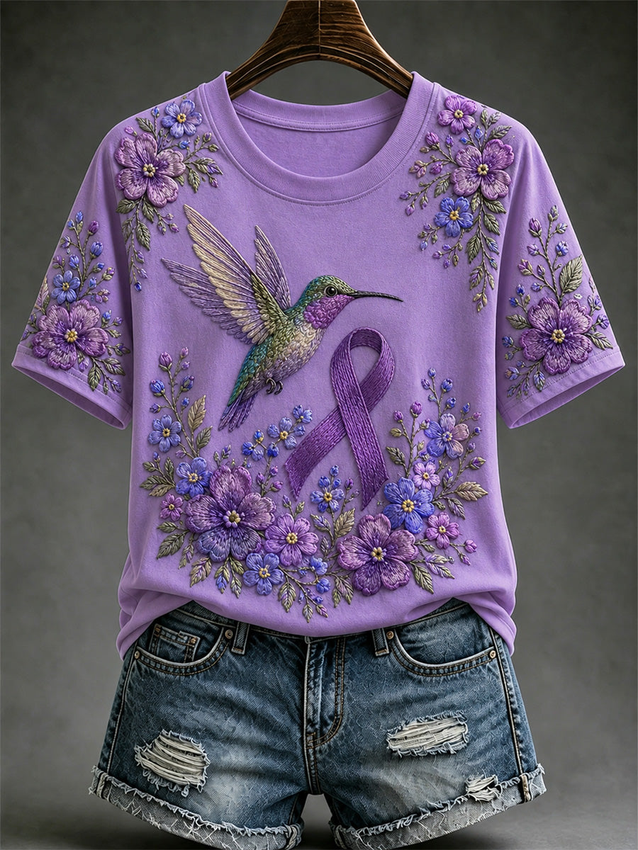 Damen-T-Shirt in Lila mit Blumen- und Kolibri-Print zur Sensibilisierung für die Alzheimer-Krankheit