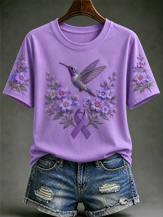 Damen-T-Shirt in Lila mit Blumen- und Kolibri-Print zur Sensibilisierung für die Alzheimer-Krankheit