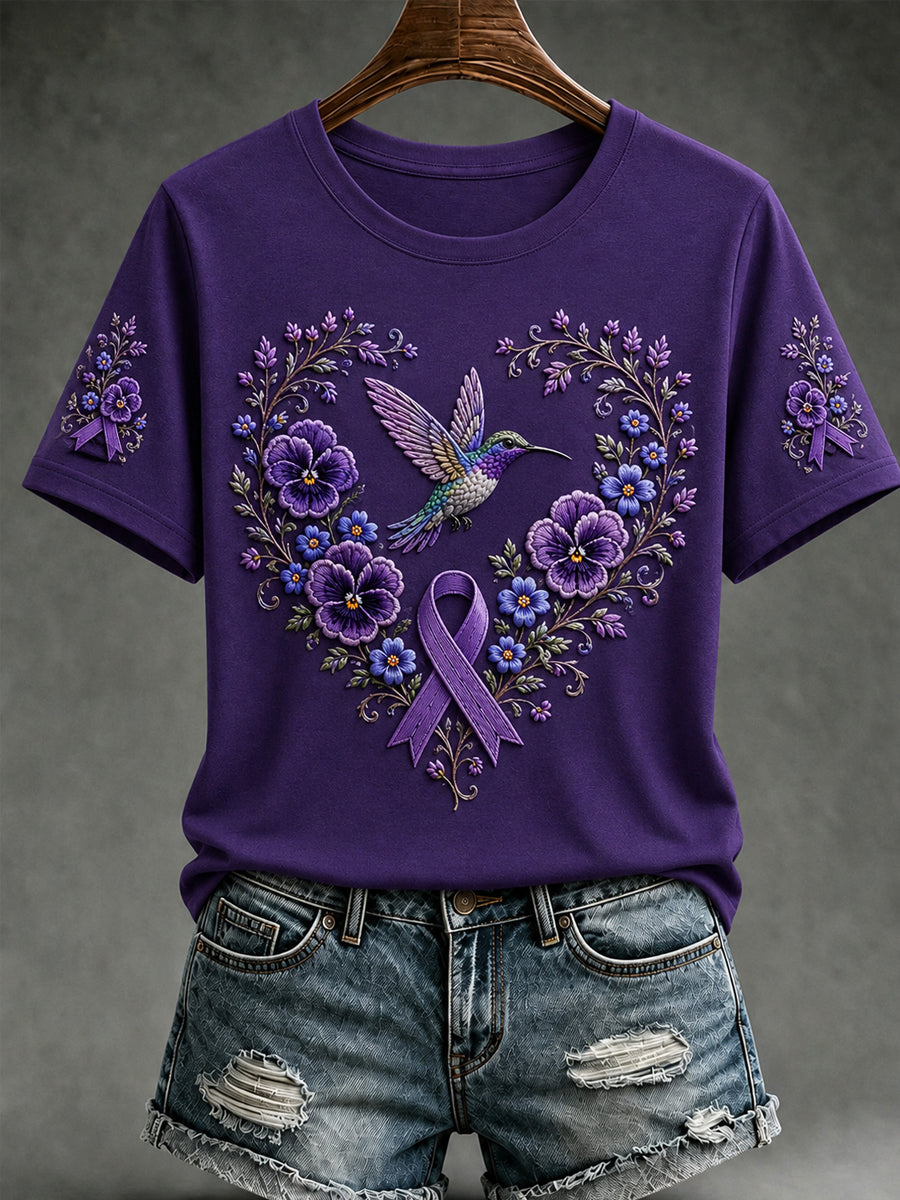 Damen-T-Shirt mit kurzem Ärmel und lila Blumen- sowie Kolibri-Print zur Sensibilisierung für die Alzheimer-Krankheit