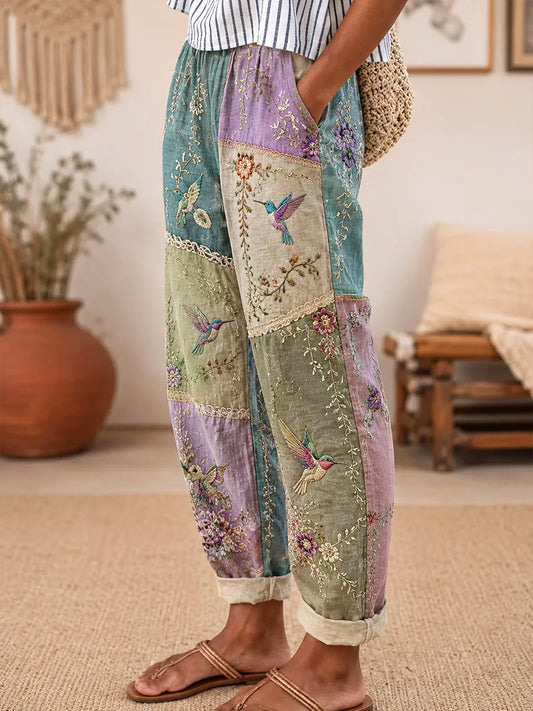 Damen-Hosen mit lila Blumen-und Kolibri druck