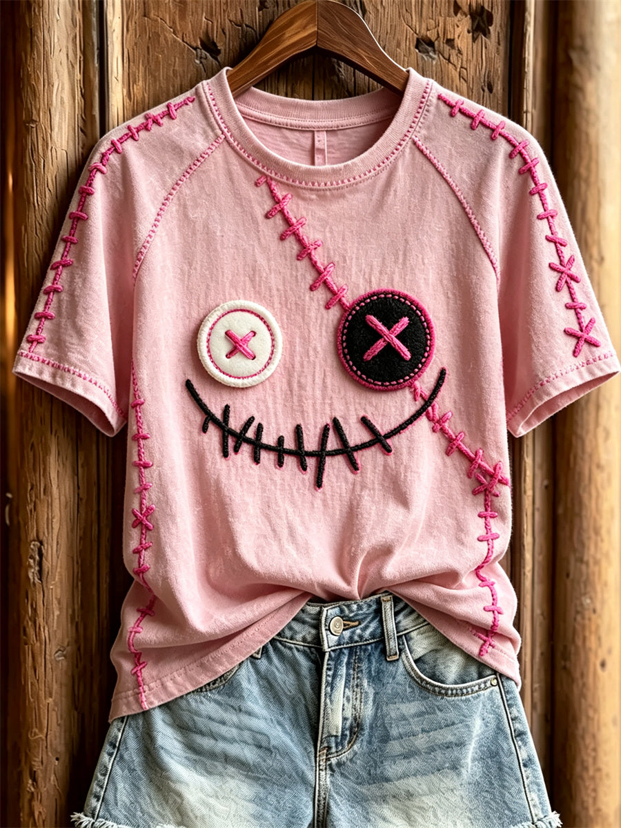 Damen-T-Shirt mit niedlichem Monstergesicht und pinkfarbenen Ziernähten, Kurzarm