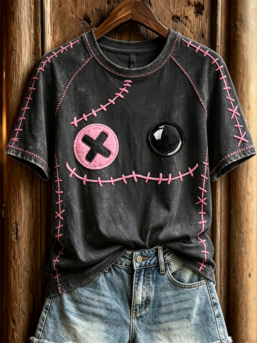 Damen-T-Shirt mit pinkfarbenen Ziernähten und Monster-Gesichtsdruck, kurzärmlig